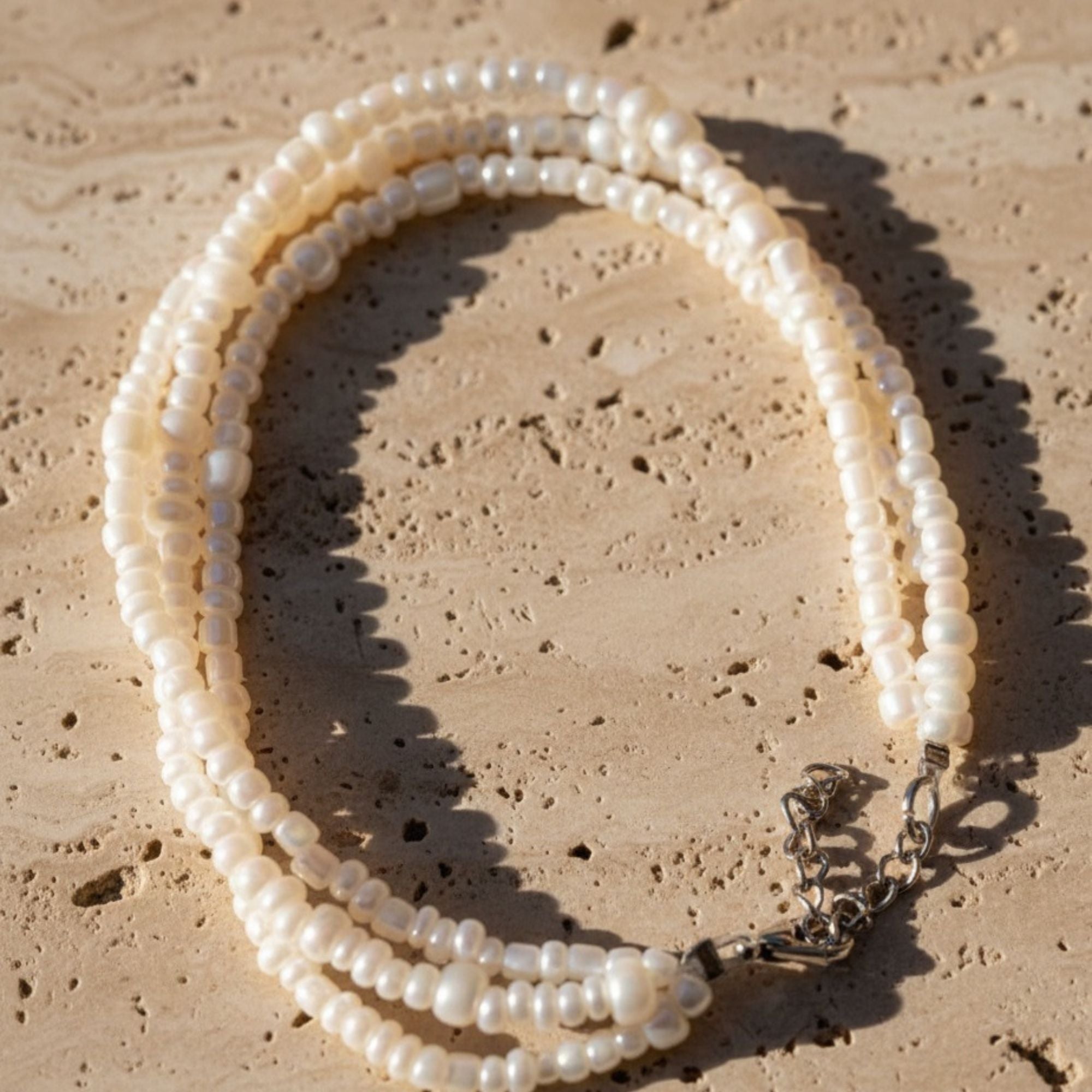 Three-Strand Pearl Bracelet in Soft Cream White – Elara