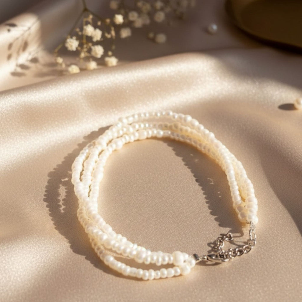Three-Strand Pearl Bracelet in Soft Cream White – Elara