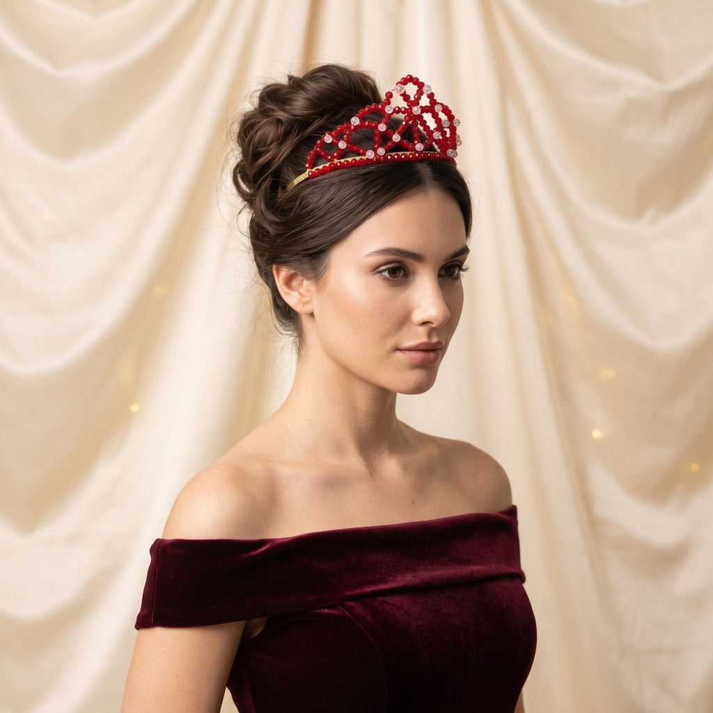 Elegant woman wearing the handmade Red Queen crown with faceted red and clear glass beads, styled with an updo and burgundy velvet dress.