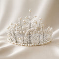 Handmade White Grace bridal crown with ivory pearls and delicate translucent glass beads arranged on fine silver-tone wire in an elegant botanical branch design.